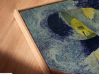 Here's a close-up of the canvas print in a floating frame. The surreal staircase artwork is in a Van Gogh style. It's dreamlike architecture. The art nouveau style is prominent with blue and yellow hues. This print enhances the depth and texture. It's perfect for a unique office space. The floating frame adds a modern touch.