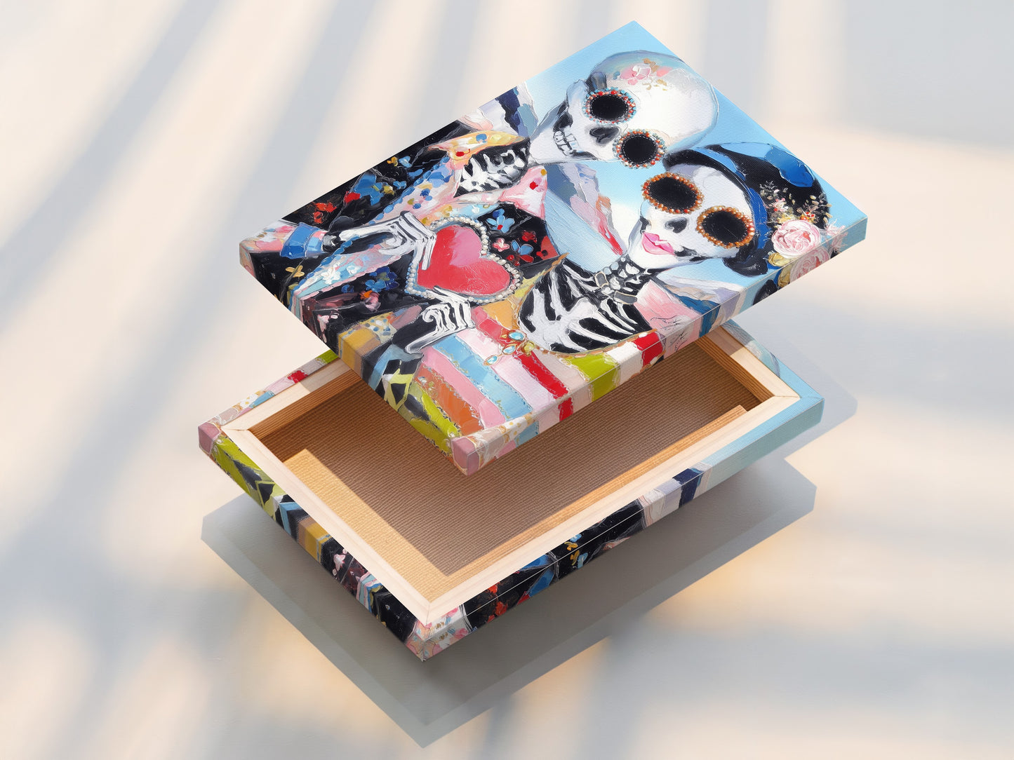 A stretched canvas print of Dia de los Muertos art. The sugar skull couple poster is taut and ready to hang. This muertos canvas offers a clean gallery-wrapped look. It is perfect for any gothic or bohemian space.