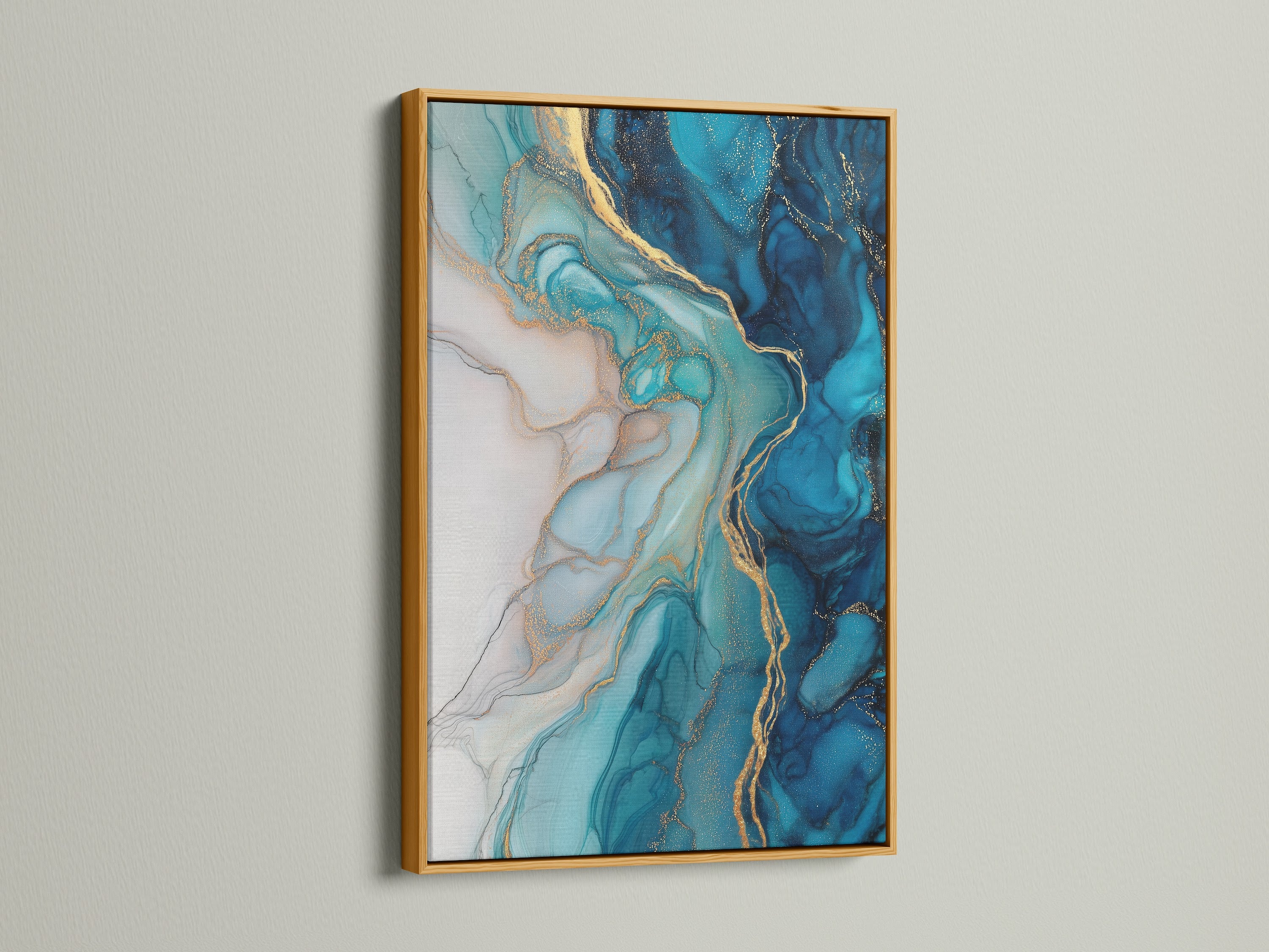 A gold frame enhances the beauty of this blue abstract art. This fluid acrylic wall art features stunning teal and gold marble patterns. Bring a touch of luxury to your living room with this contemporary artwork. Perfect for homeowners and interior designers seeking elevated wall decor.