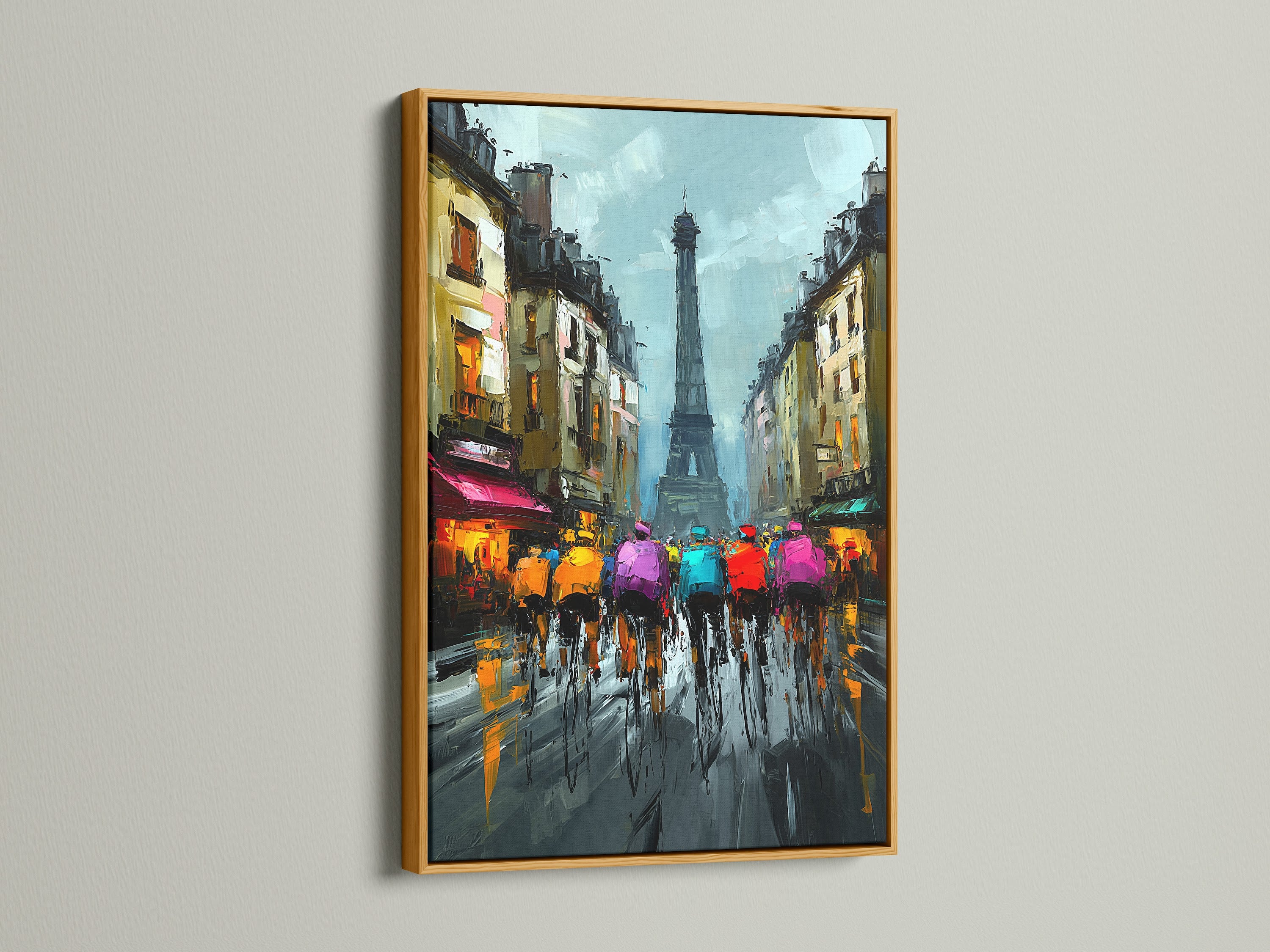 Artwork of cyclists riding in Paris with the Eiffel Tower in a gold frame. The gold frame adds a luxurious touch. This artwork brings a touch of elegance to any interior. Perfect for adding a touch of glamour to your home or office. The painting is a showstopper.