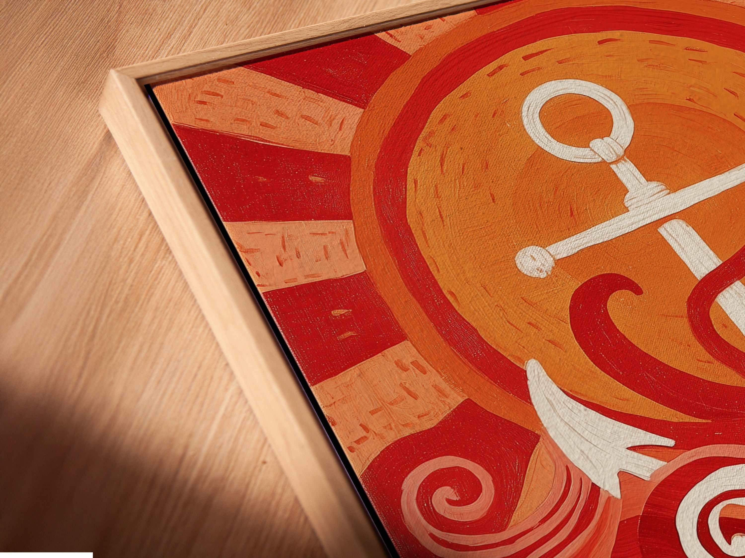 A close-up of a canvas print in a floating frame. The artwork shows an anchor and ocean waves. The colors are red white and black. This nautical canvas is great for coastal decor. The floating frame adds a modern touch to this vintage maritime artwork. It makes a perfect gift for sailor.