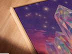 A close-up angled view of a canvas print in a floating frame. The Crystal Fantasy Art Print looks stunning in this modern frame. The mystical purple landscape is perfect for adding surreal artwork to your home or office. Shop now.
