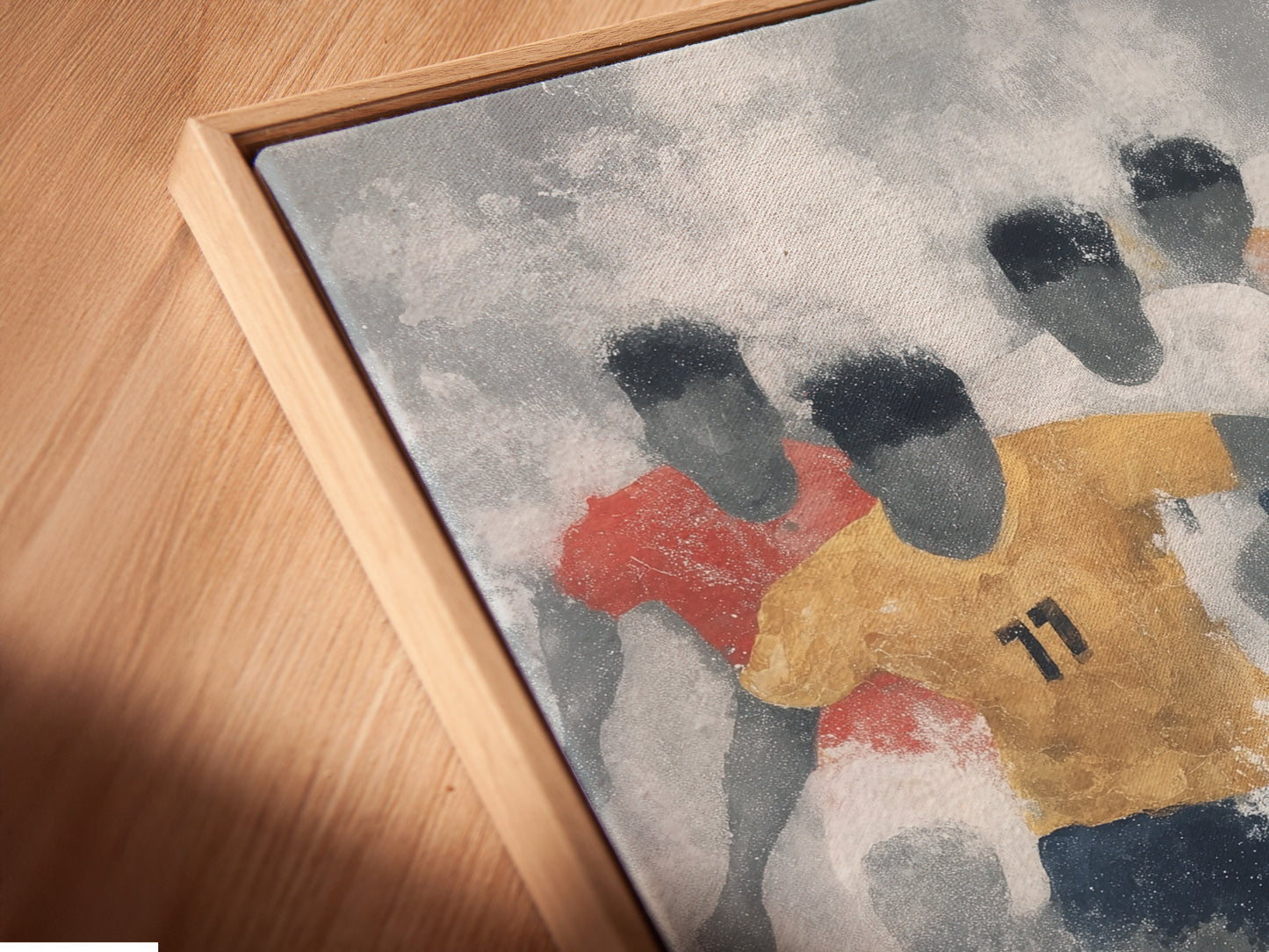 Close-up angled view of a canvas print in a floating frame. This sports art print adds depth and sophistication. The floating frame enhances the modern appeal of the soccer artwork. A stylish choice for contemporary wall decor in any space.
