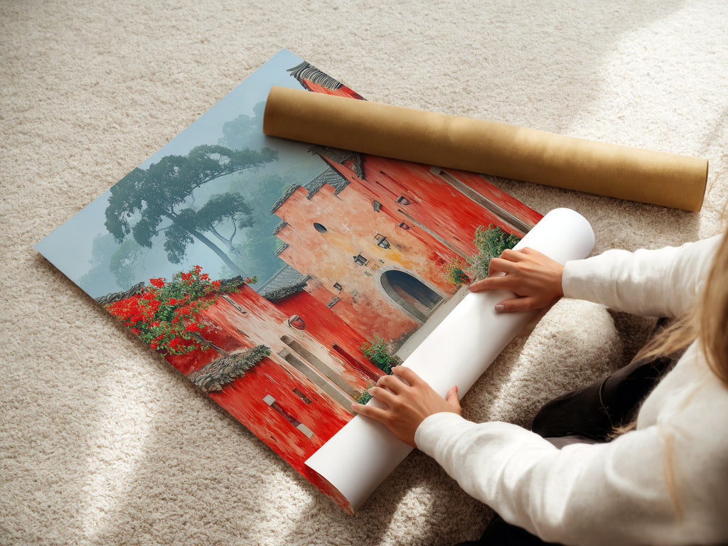 A woman is carefully rolling a fine art poster paper print of the Village Street art.  This print captures the beauty of a European village scene.  It is perfect for those seeking elevated vintage aesthetics. The fine art paper enhances the details.
