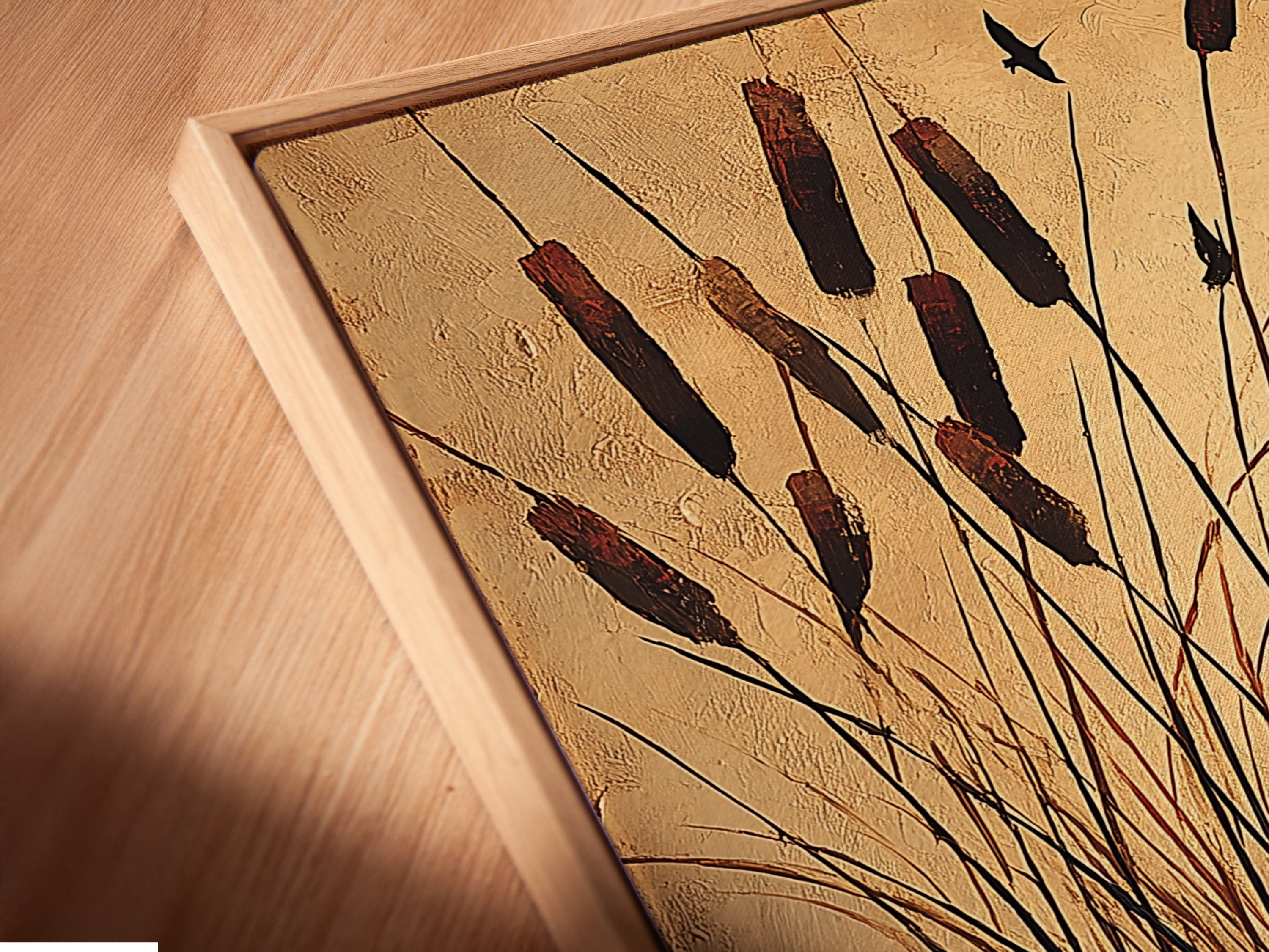 Angled close-up of a cattails canvas print in a floating frame. The floating frame enhances the art. This coastal wall art is perfect for neutral home decor. The artwork adds a calming touch.