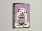 A framed artwork displays a cute hedgehog. This art is showcased with an oak frame. The frame enhances the artwork's appeal. This piece adds warmth to the space. Perfect for animal lovers or anyone seeking cozy art.