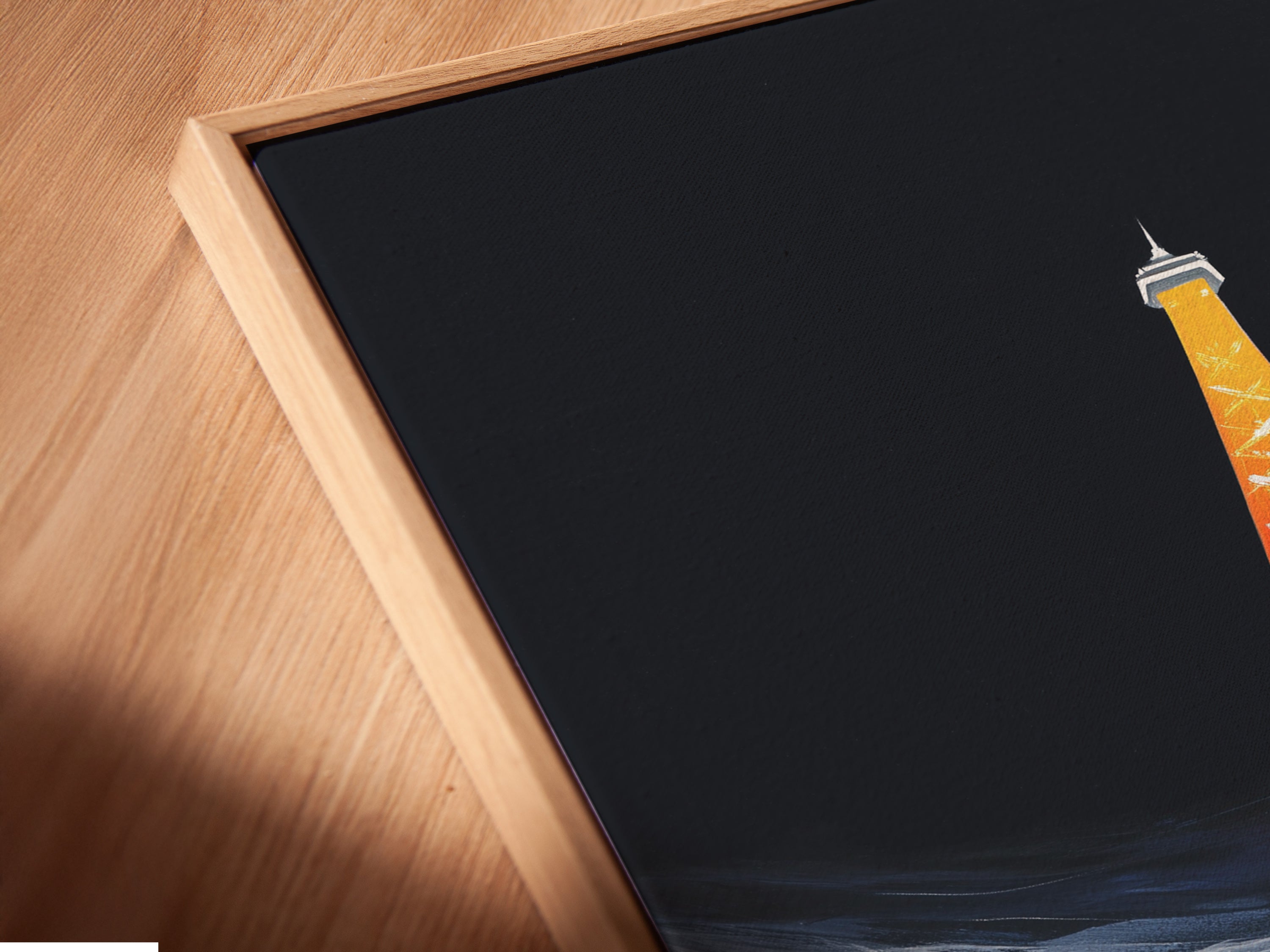 A canvas print of the Eiffel Tower is presented in a floating frame. The floating frame adds depth and dimension to the artwork. It creates a gallery-like display for your European art. Elevate your modern Paris art with this unique frame.