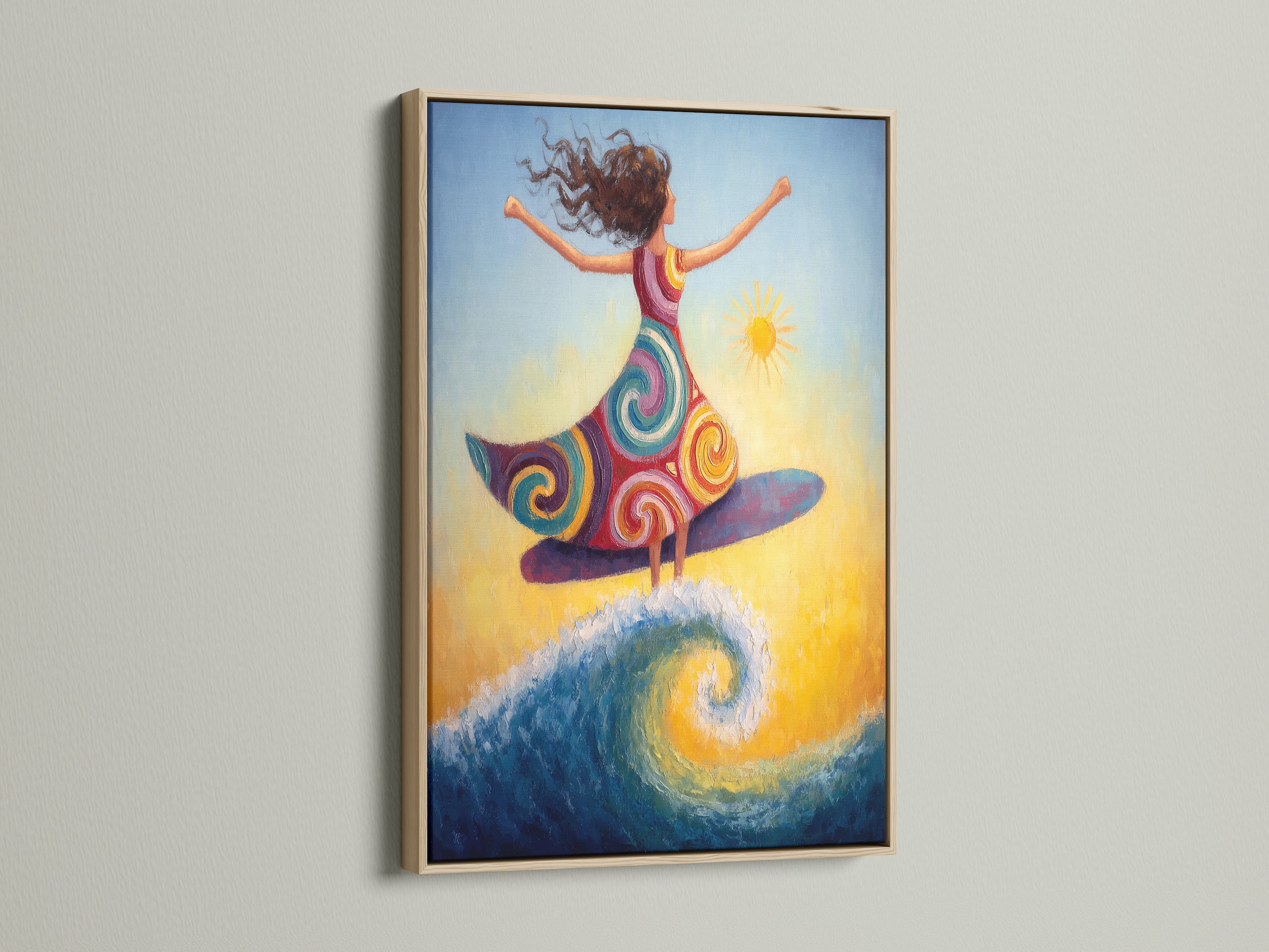 A surfing girl canvas artwork is beautifully presented in an oak frame. This colorful ocean wave print brings a bohemian touch to your space. Ideal for adding coastal artwork to beach houses and studios. This piece captures the essence of summer.