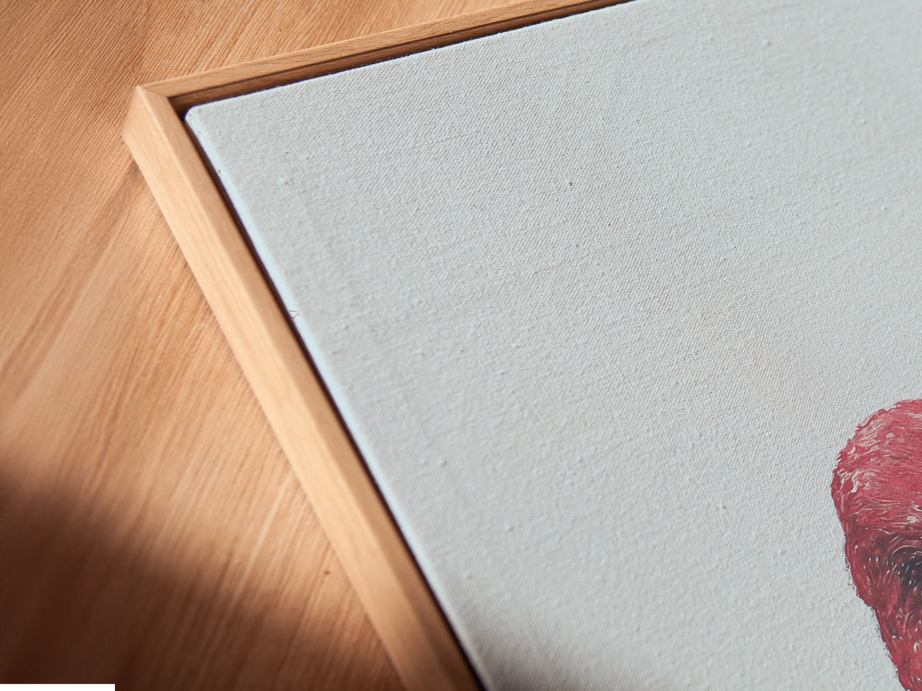 A close-up of a canvas print in a floating frame. The flamingo artwork enhances any interior. Discover how this art elevates spaces.