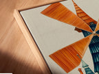 Angled close-up of a canvas print in a floating frame. Showcasing a whimsical windmill art print. This Dutch architecture canvas adds colorful folk art to any space. Ideal for unique wall art and playroom decor.