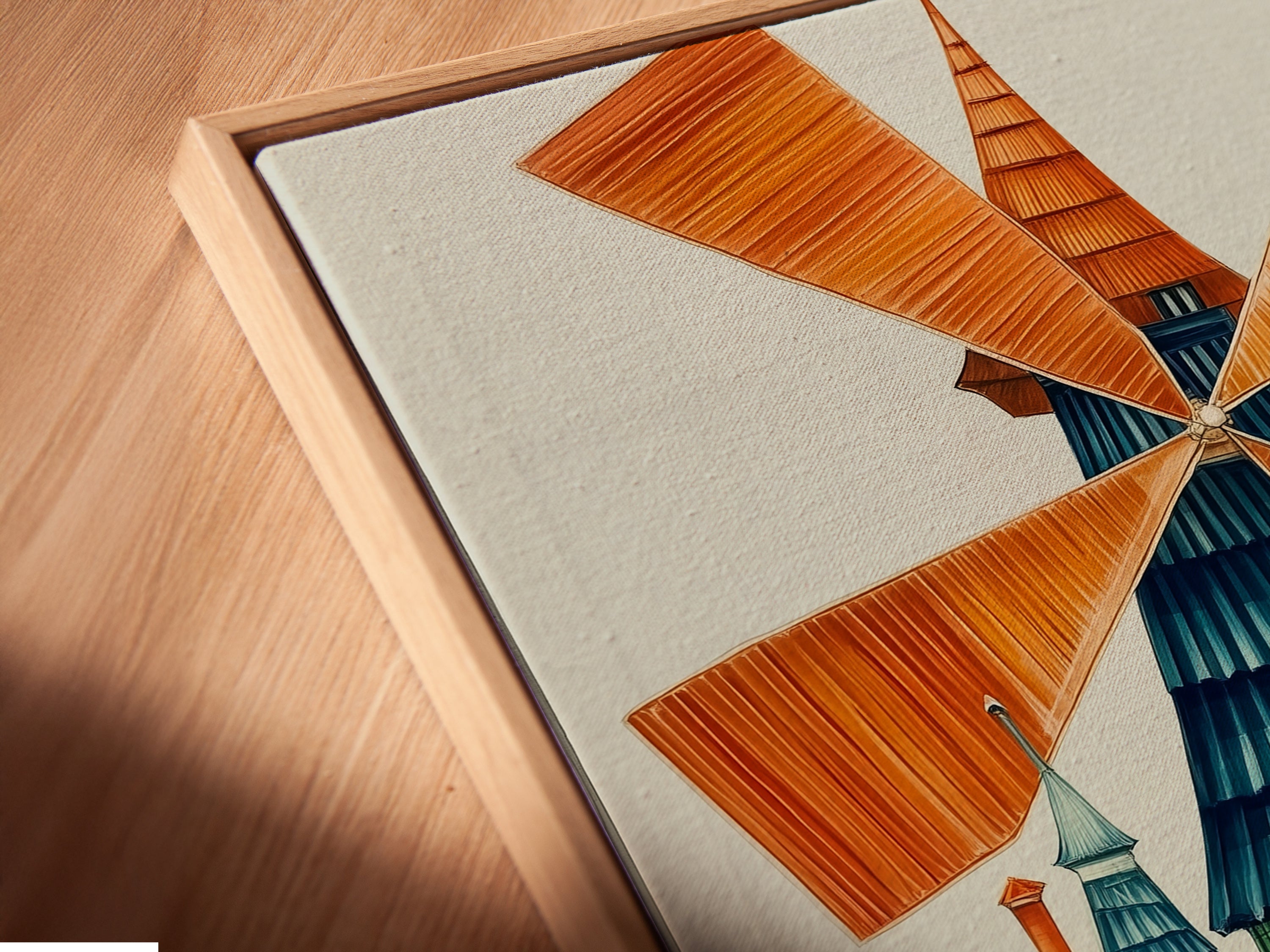 Angled close-up of a canvas print in a floating frame. Showcasing a whimsical windmill art print. This Dutch architecture canvas adds colorful folk art to any space. Ideal for unique wall art and playroom decor.