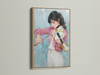 Violinist canvas art showcased in an oak frame. The artwork features a girl playing a violin. The canvas enhances the musical artwork. This artwork makes a thoughtful musician gift. It is ideal for adding a touch of sophistication to any space.