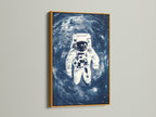 The astronaut space artwork print is framed in a luxurious gold finish. The golden frame complements the blue galaxy wall art. It brings a touch of elegance to any room. Perfect for homeowners and business owners.