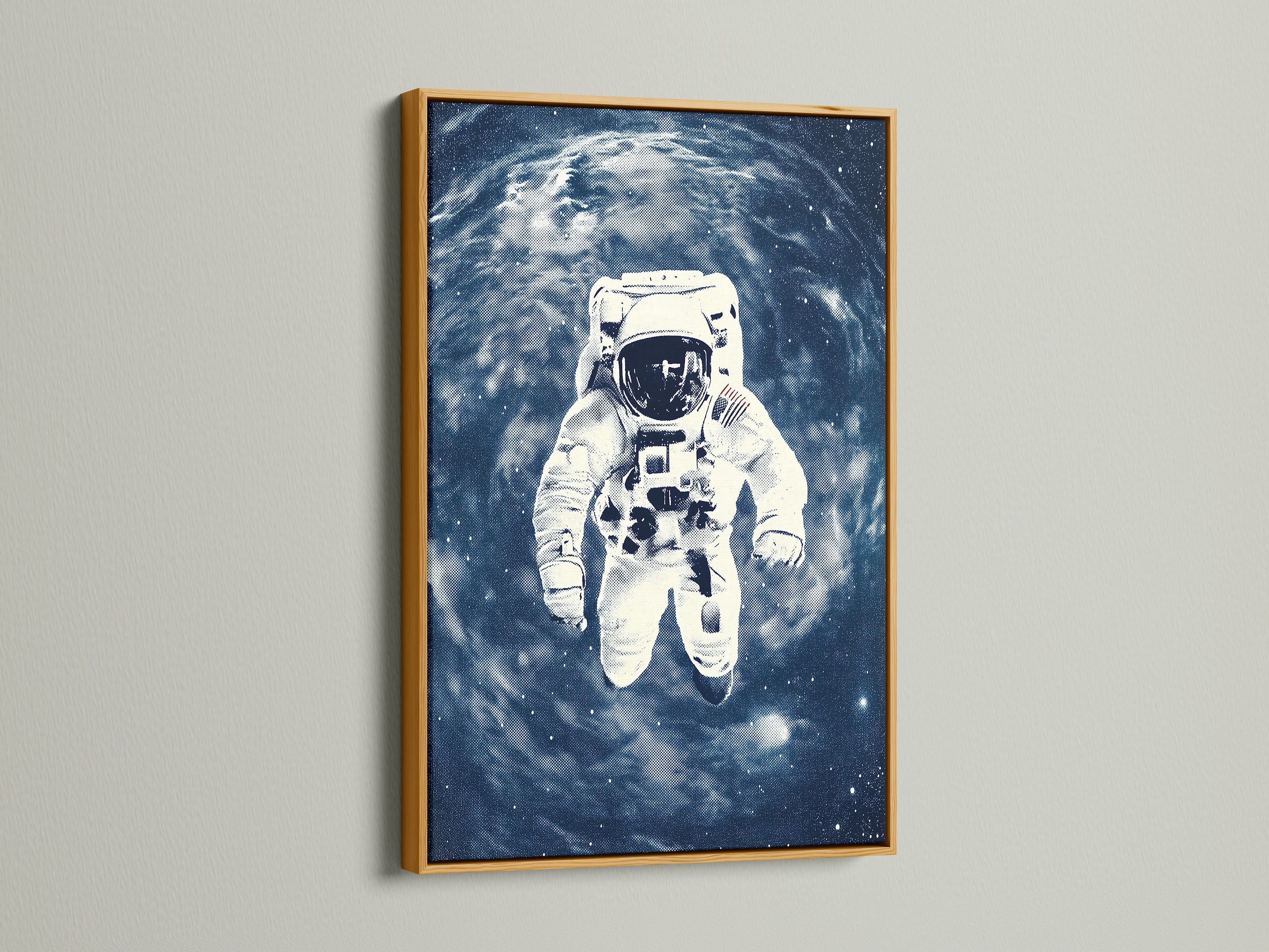 The astronaut space artwork print is framed in a luxurious gold finish. The golden frame complements the blue galaxy wall art. It brings a touch of elegance to any room. Perfect for homeowners and business owners.