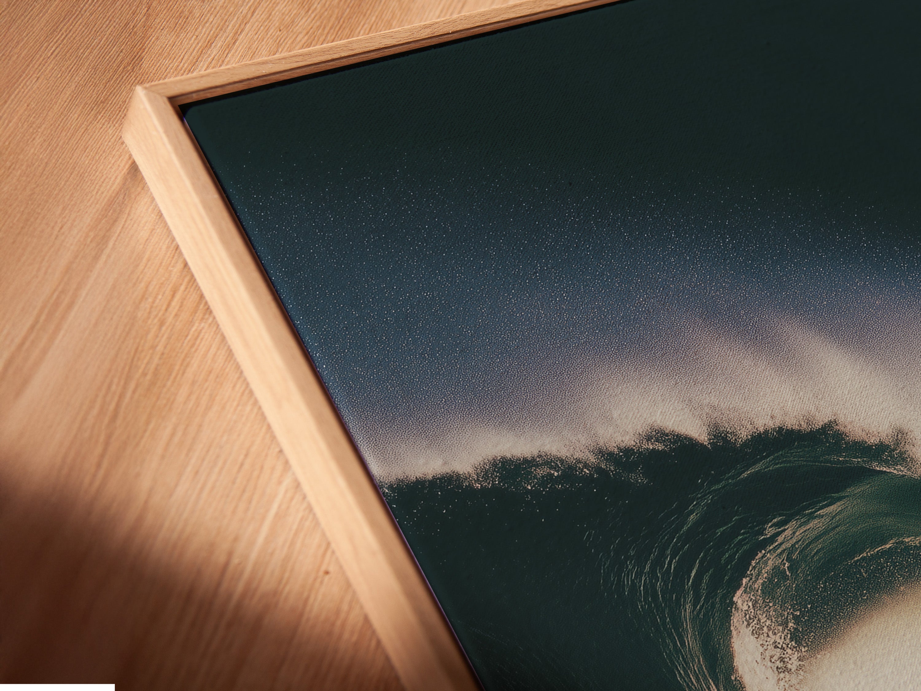 An angled close-up showcases canvas artwork. The art is displayed in a floating frame. The floating frame adds depth. It creates a contemporary look. The canvas texture is visible. This artwork is ready to hang.