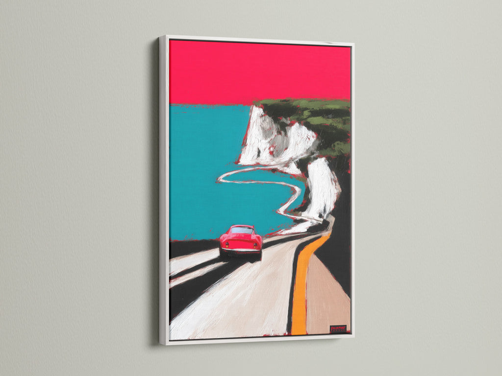 Coastal road artwork print in a white frame. This mid-century modern piece features a red car on a winding road. The white frame offers a clean and contemporary look. Perfect for adding a pop of color and retro style to your living space. A great addition to any art collection.