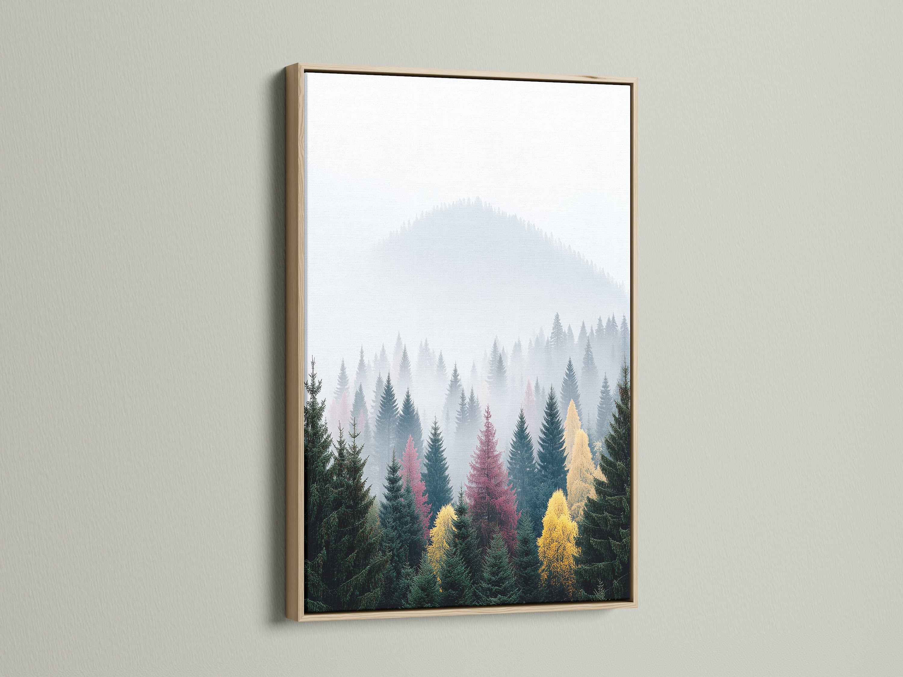 Misty mountain forest canvas print in an oak frame. This nature print adds serene beauty to any room. The landscape wall art is ideal for living rooms and offices. It suits Scandinavian and modern decor. A perfect nature photography print.