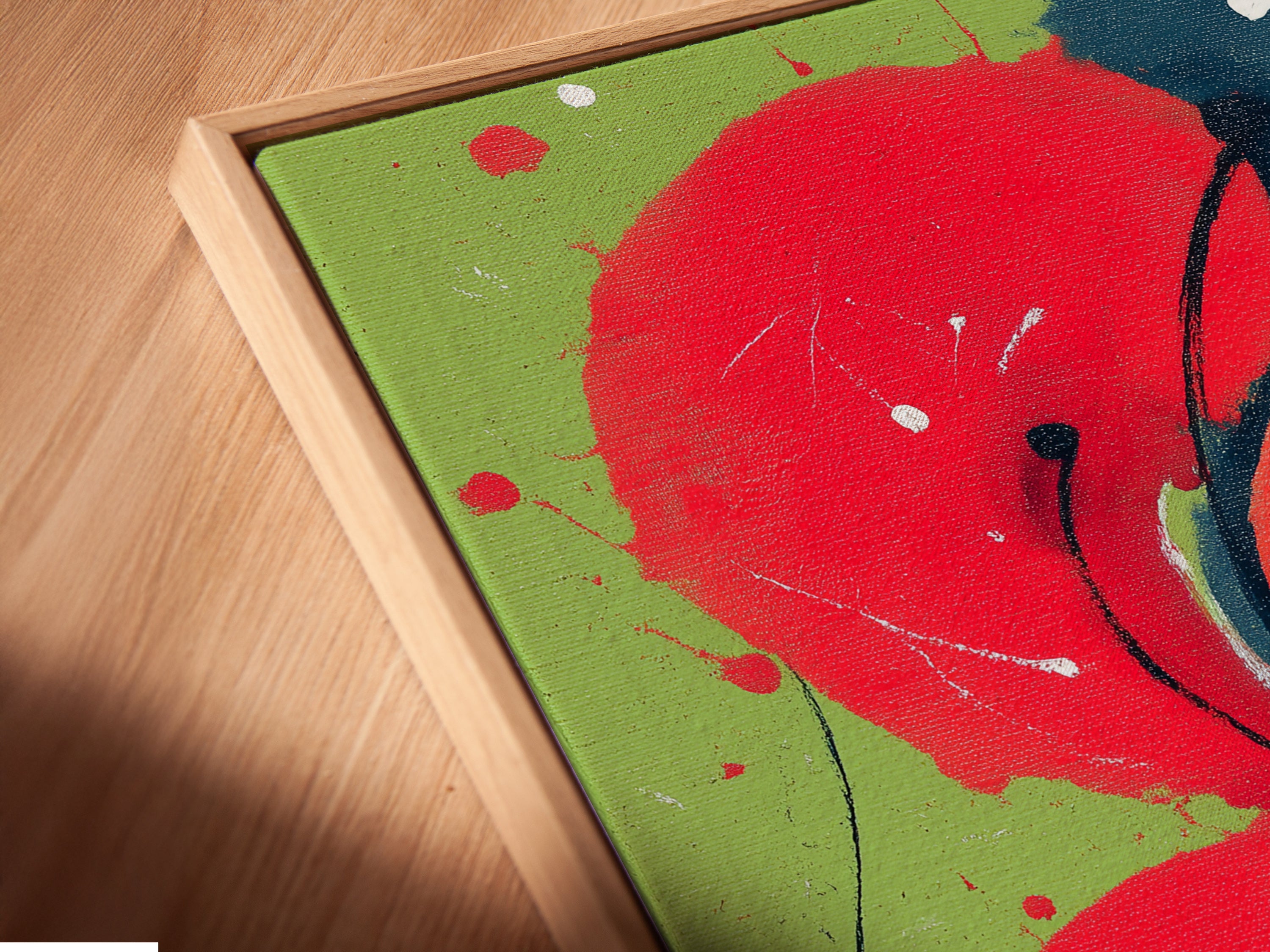 A close-up of a canvas print in a floating frame. View the abstract floral artwork from an angle. The red and blue modern botanical art is highlighted. Experience the depth and texture of this unique wall decor. It's perfect for adding a modern touch to any room.