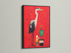 Heron Art Canvas Print in a black frame. The red abstract wall art features a modern bird artwork. This artwork makes a bold statement. The black frame adds a sleek sophisticated look.