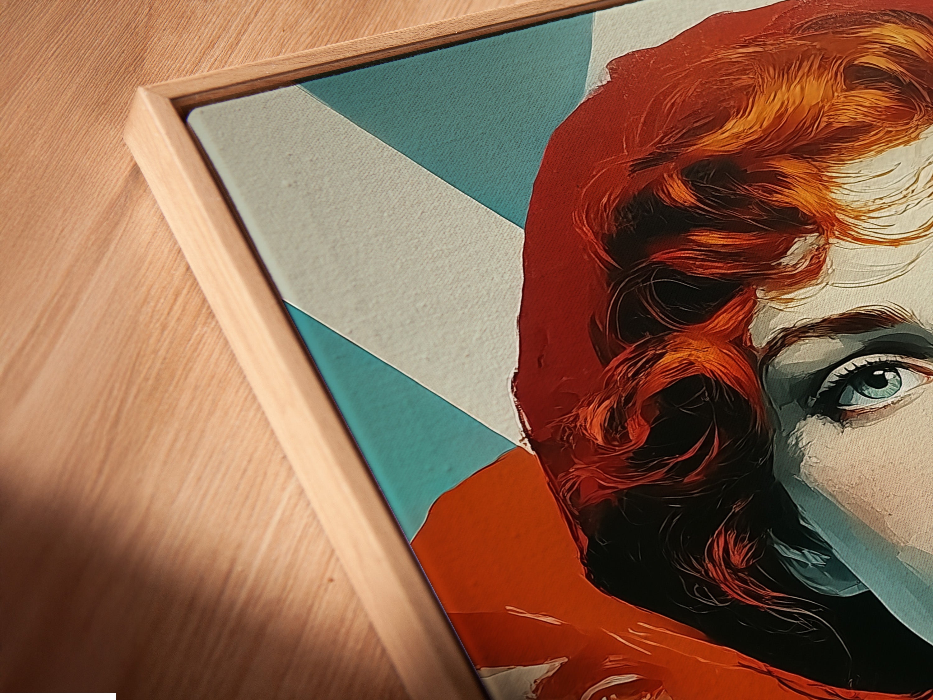 Angled close up of a canvas print in a floating frame. Retro Woman Art in vintage pop art style wall decor. The artwork features red hair and teal orange hues. The contemporary art is great for any room.