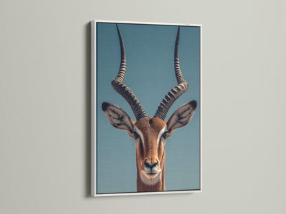 A striking Impala art print is showcased. It is framed in a clean white frame. The white frame offers a modern touch. This frame makes the artwork pop against the wall.