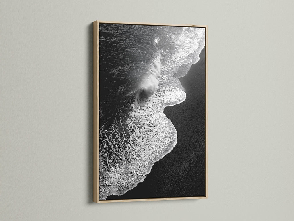 This is a captivating black and white ocean wave artwork print. It is presented in an oak frame. Ideal for adding a touch of minimalist decor. The beach canvas print enhances any space. It is suitable for those seeking refined coastal wall art. Perfect for living rooms bedrooms and offices.