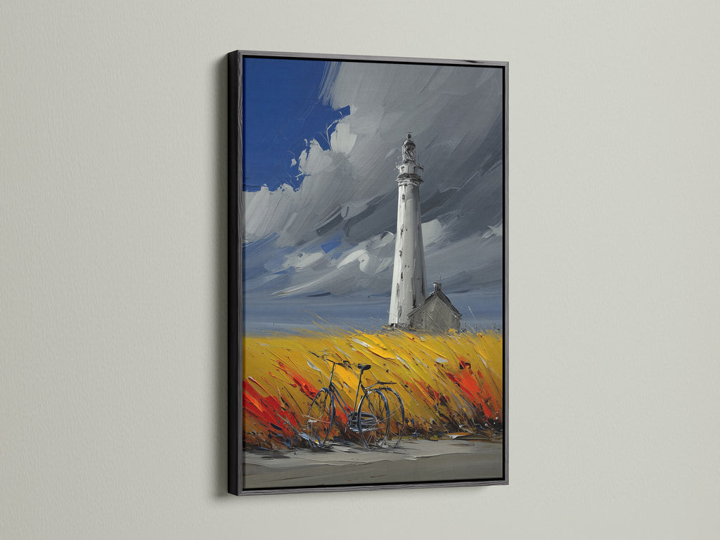 Lighthouse coastal artwork with a black frame.  This ocean wall art is a stunning addition to any space.  Consider this piece for office wall art or a seaside cafe. The painting includes a bicycle in a colorful field. The lighthouse stands tall against a cloudy sky. The artwork makes a bold statement.