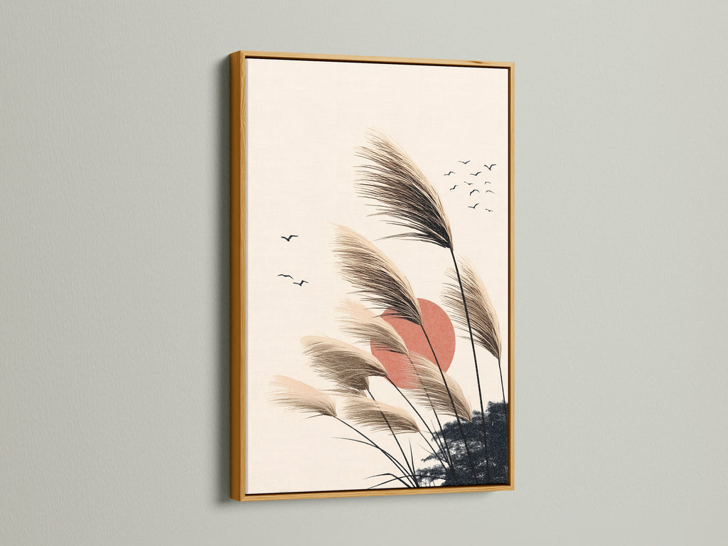 Pampas Grass artwork in a gold frame. This boho wall art brings a touch of luxury. Perfect for minimalist nature artwork in a bedroom. The sunset canvas and neutral decor create a warm ambiance. A great choice for scandi art or bohemian interiors. Enhance your living space with this elegant piece.