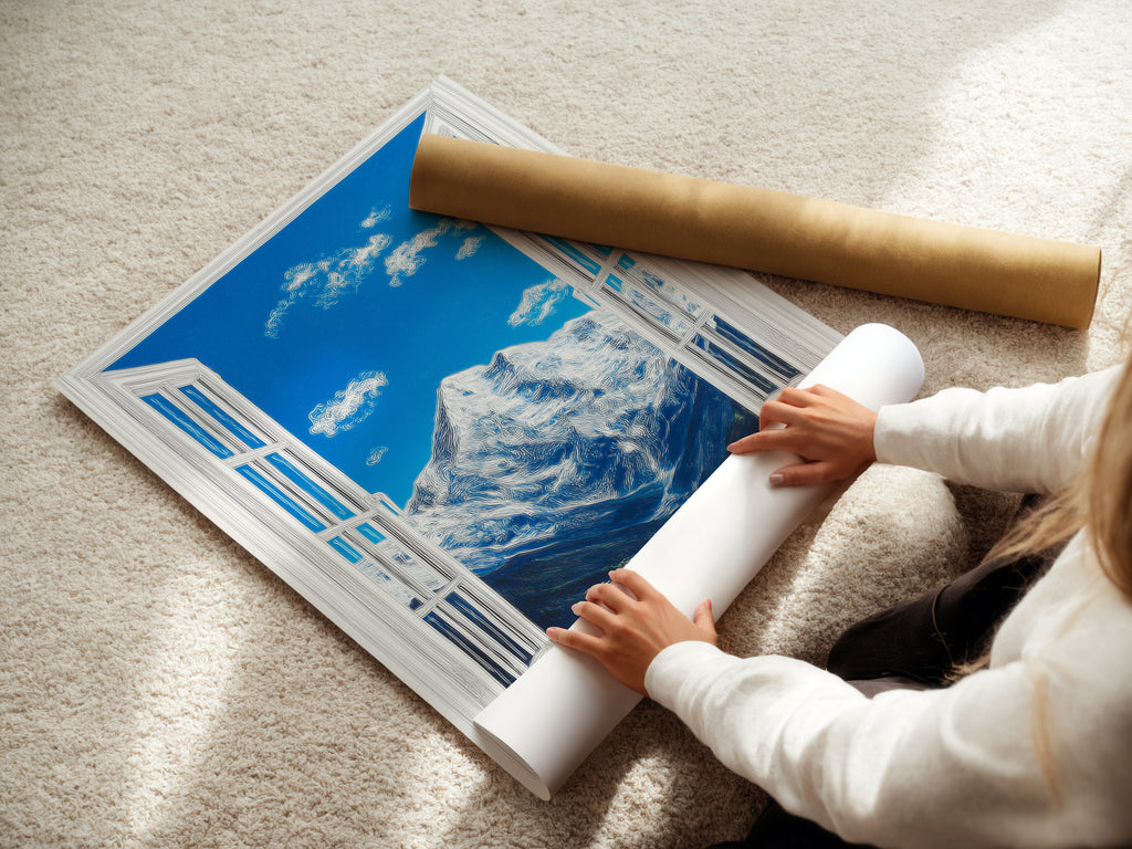 A woman is carefully rolling a fine art poster paper. The poster features a mountain view. The artwork has a bright blue sky with fluffy clouds. A snow-capped mountain is visible through a window. This is high-quality printing.