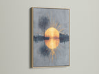 The sunrise reflection artwork is showcased in a light oak frame. The abstract cityscape and golden hour hues create a calming effect. This modern wall art piece adds warmth and sophistication to any room. Perfect for home decor.
