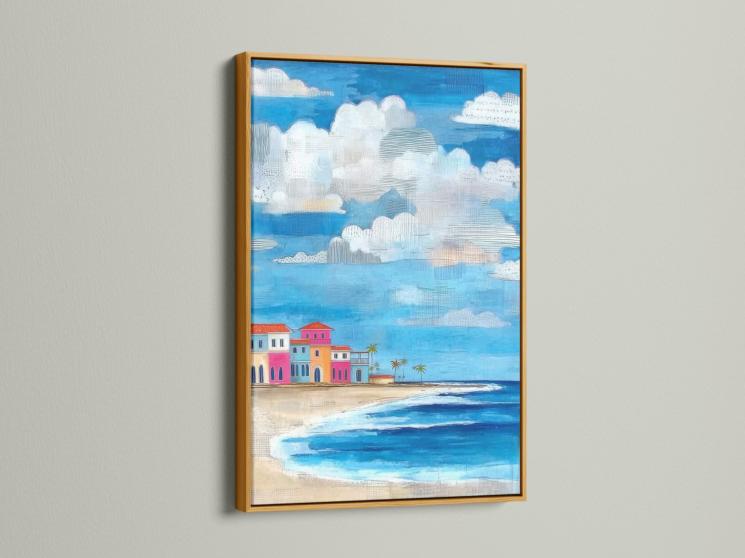 Coastal beach artwork with a gold frame. The artwork presents colorful beach houses. This tropical seascape wall art is luxurious. The gold frame adds elegance to the artwork.