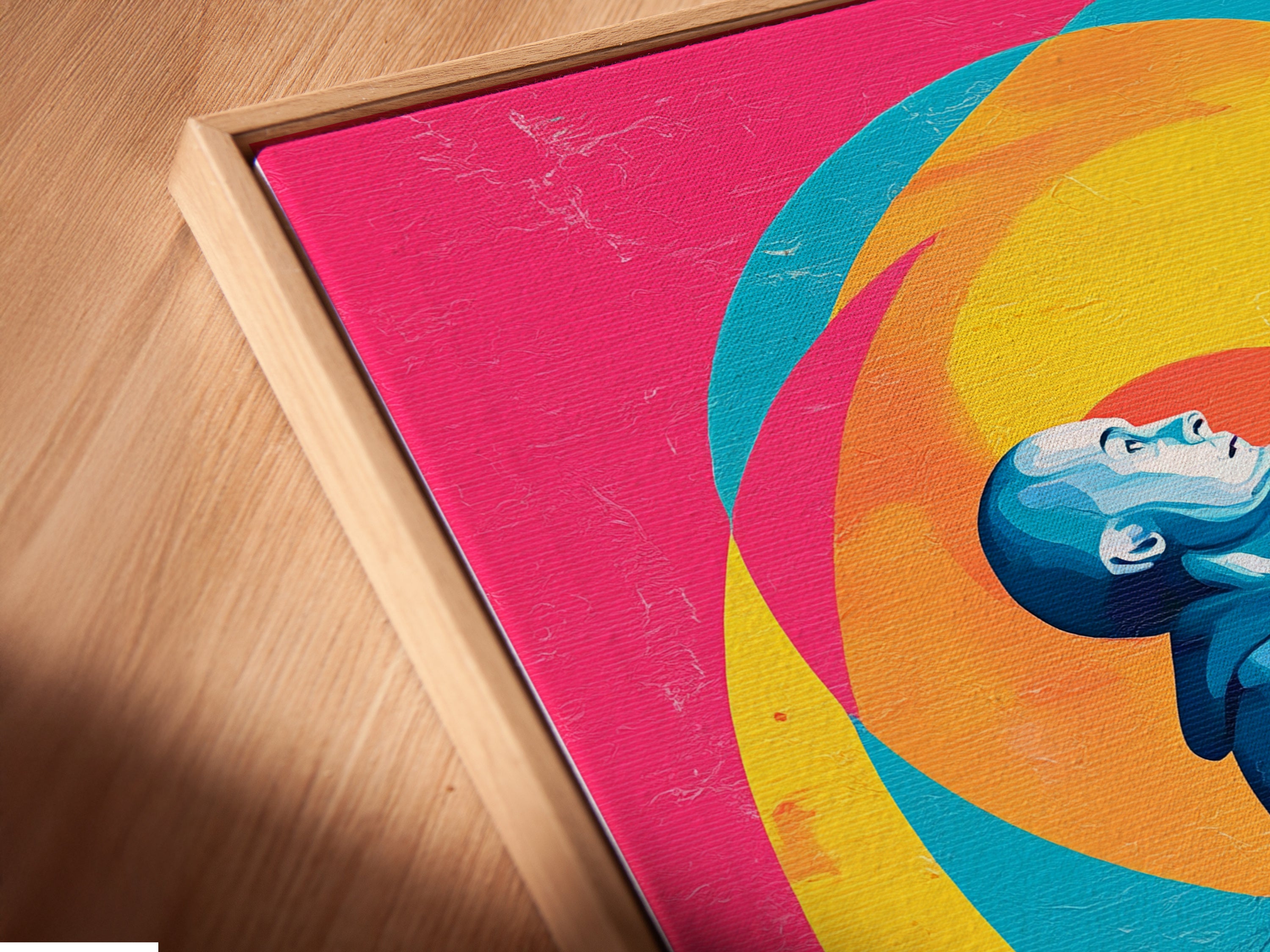 Close-up of a canvas print in a floating frame. The Praying Figure artwork showcases teal blue and pink decor. This religious art is perfect for creating a spiritual ambiance. The floating frame adds a modern touch.