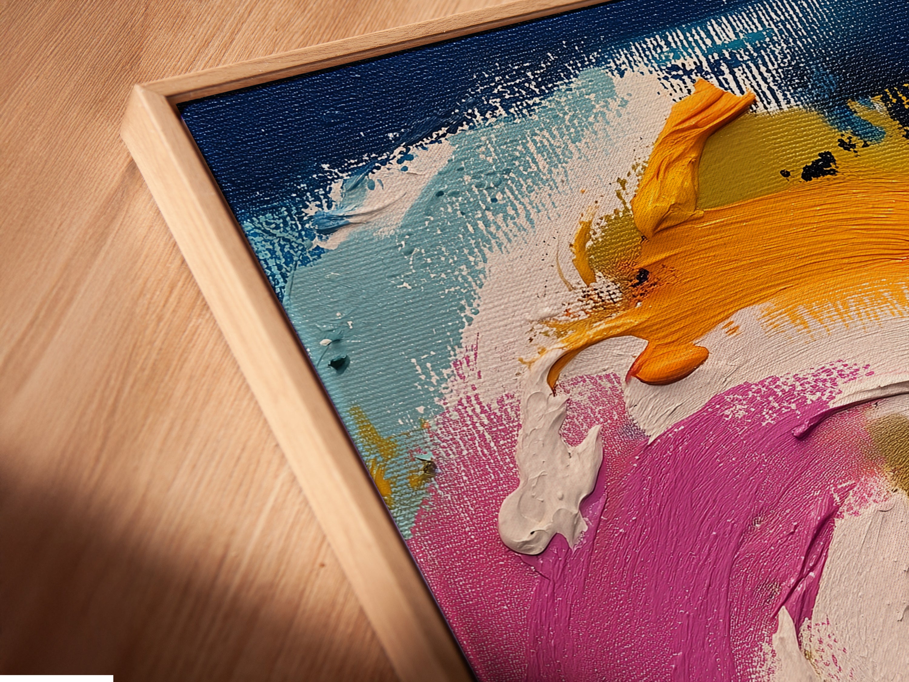 A close-up angled view reveals a canvas print in a floating frame. The abstract swirl artwork is beautifully displayed. The floating frame adds depth and dimension to the piece. This modern artwork is ready to hang and enjoy.