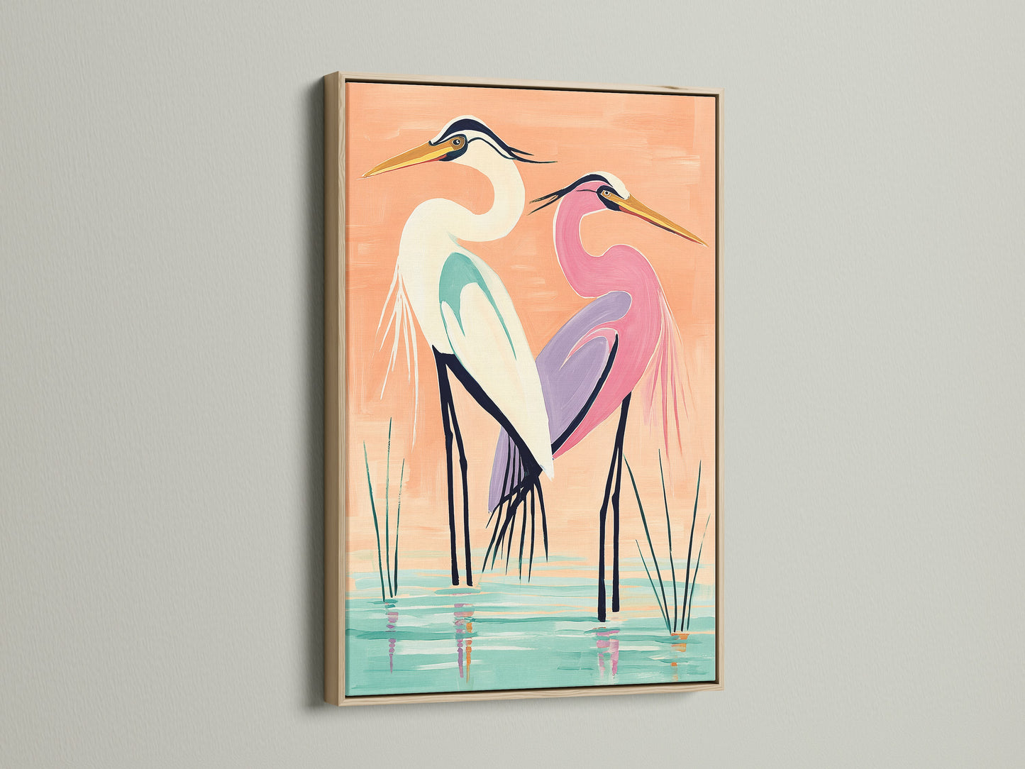A coastal bird wall art piece featuring herons is displayed in an oak frame. The oak frame enhances the natural beauty of the heron artwork. This frame is perfect for homeowners renters interior designers and business owners seeking elevated modern wall art. This heron art fits coastal minimalist or contemporary styles.