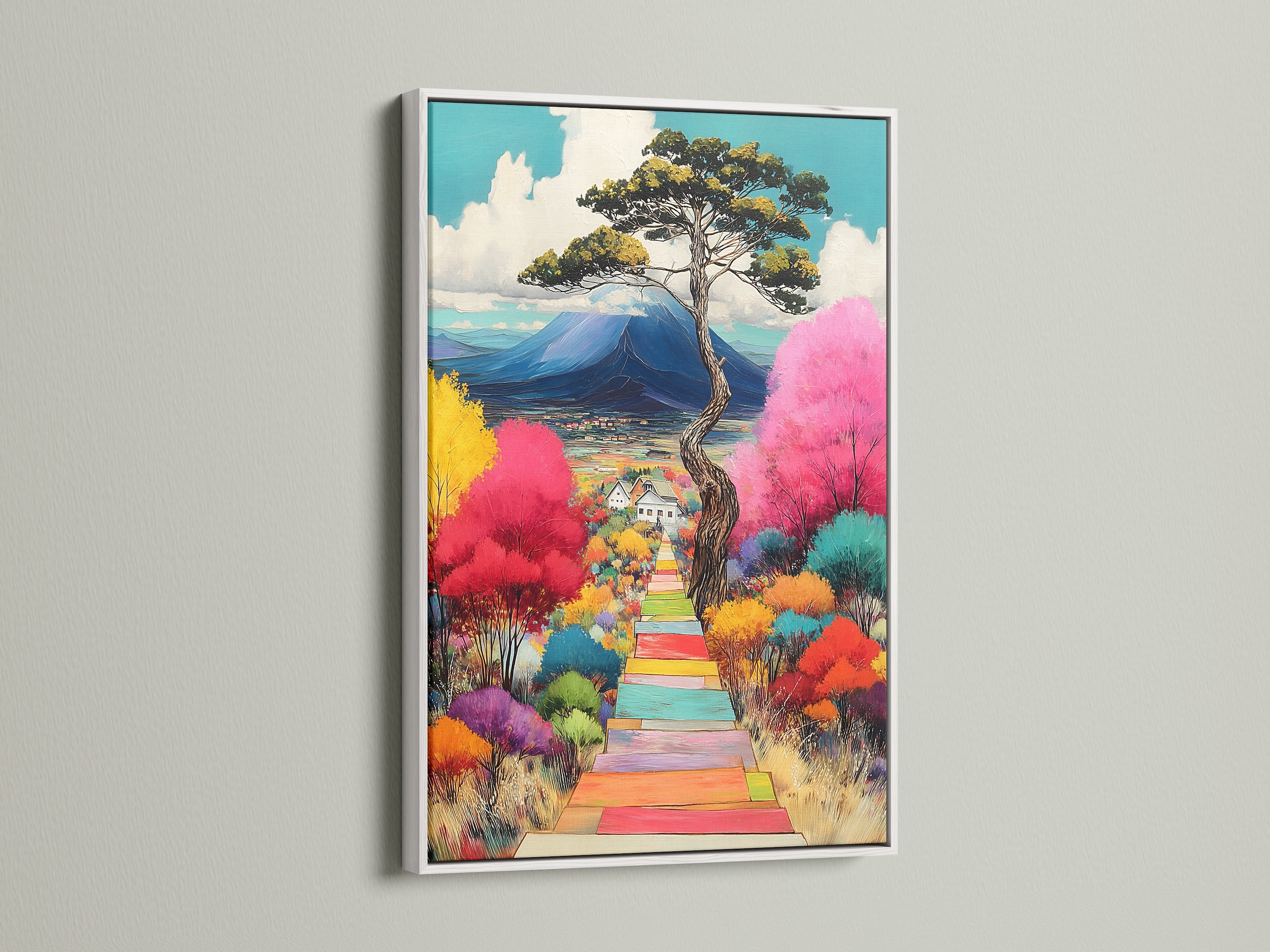This colorful landscape artwork is framed in white. The nature print features a mountain view and whimsical trees. It offers a clean modern look. It's perfect for adding a vibrant touch to any room in your home.