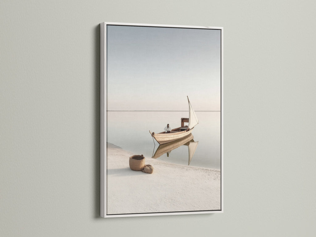 Nautical Wall Decor in a white frame. This serene art piece captures a beautiful seascape. Perfect for adding a touch of the coast to your home. The white frame enhances the minimalist aesthetic.