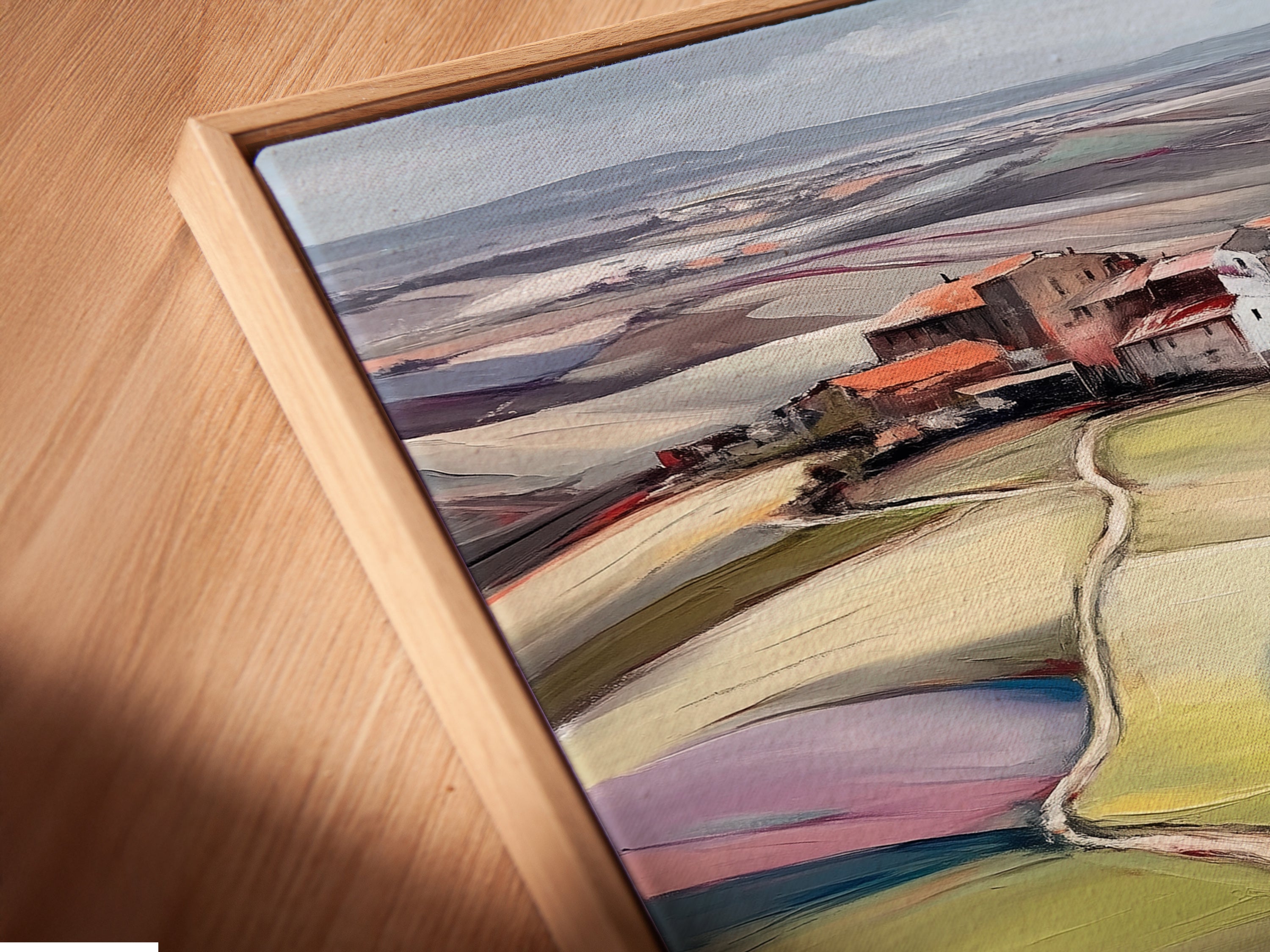 Close-up of a Tuscany Landscape canvas print in a floating frame. The floating frame gives a modern touch. The Italian art print appears to float on the wall. Adds depth and dimension to the countryside decor. Perfect for any room.