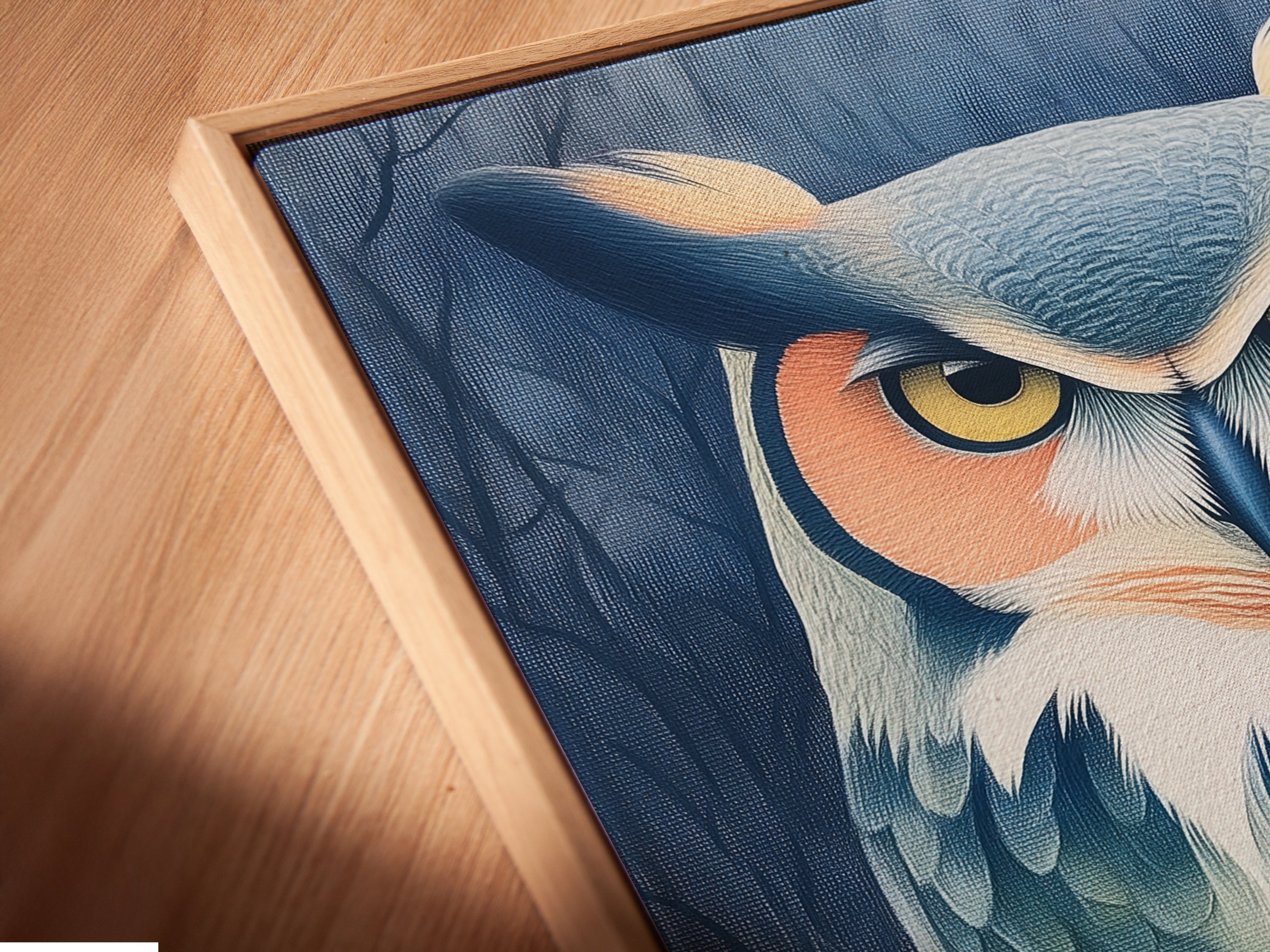A close-up angled view shows a canvas print in a floating frame. The owl portrait is perfect moody wall art. Teal and beige tones blend seamlessly in this animal artwork. Ideal for study rooms or eclectic decor styles.