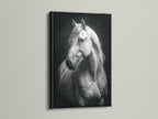A black and white horse canvas print in a sleek black frame. This animal art is perfect for office decor or modern interiors. The monochrome print adds a sophisticated touch.