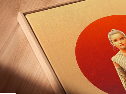 A close-up shot showcases a canvas print in a floating frame. This Star Wars art is a unique display option. The floating frame accentuates the desert sunset artwork. Bring modern movie art to your home office.