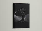 A striking black frame encases this golfer silhouette art print. The black and white golf art adds a touch of sophistication to any room. This sports canvas print is perfect for modern sports decor in an office or home.