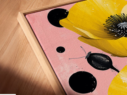 A close-up view of a canvas print in a floating frame. The Yellow Poppy artwork is beautifully showcased. This floral wall art enhances bedroom wall decor with a modern botanical touch. The floating frame adds depth.