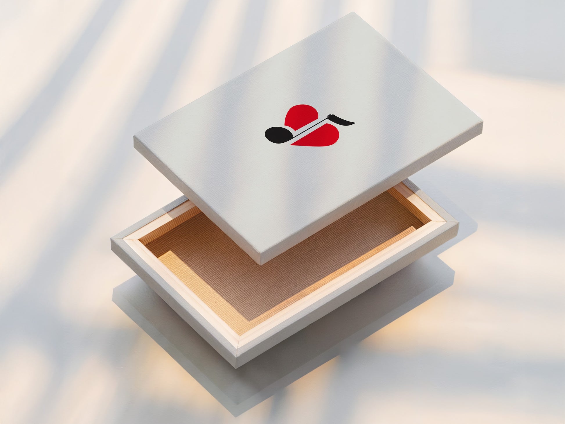 This is a stretched canvas print of music note heart art. The minimalist art is ready to hang. The red and black colors create a striking contrast. It's ideal for music room decor.