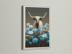 Longhorn bull art with blue wildflowers in a white frame. This is a botanical canvas. Western wall decor is perfect for any room. The bull canvas print is ideal for modern farmhouse decor. A blue floral art piece for your home.