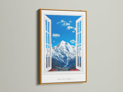 A mountain view artwork is framed in gold. The artwork features a bright blue sky with fluffy clouds. A snow-capped mountain is visible through an open window. The sky wall art enhances any space. Consider this framed canvas art.
