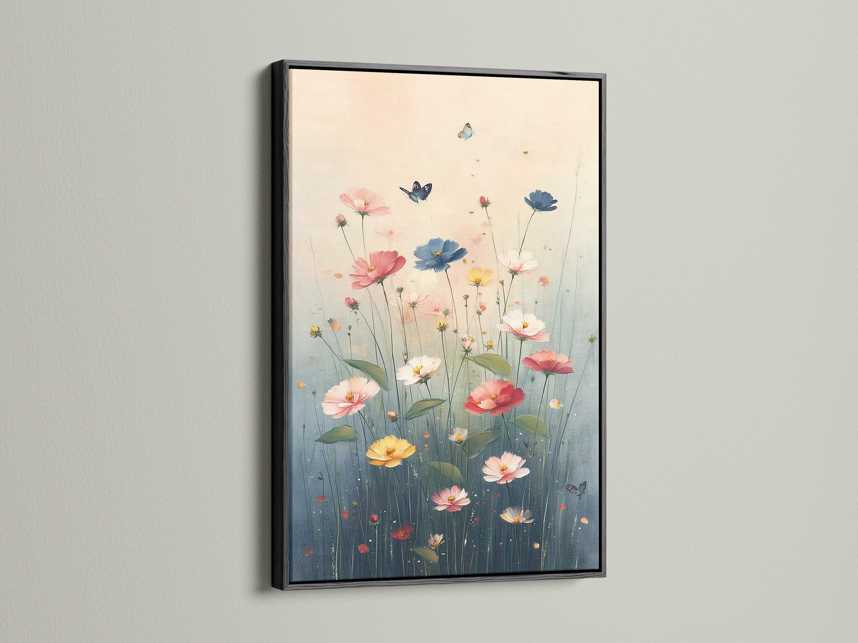 Floral Meadow canvas print with a sleek black frame on a white wall. The artwork features a vibrant array of wildflowers. Butterflies flutter around the flowers. The black frame adds a modern touch. This floral artwork is a beautiful addition to any home decor. Add color to your living space.