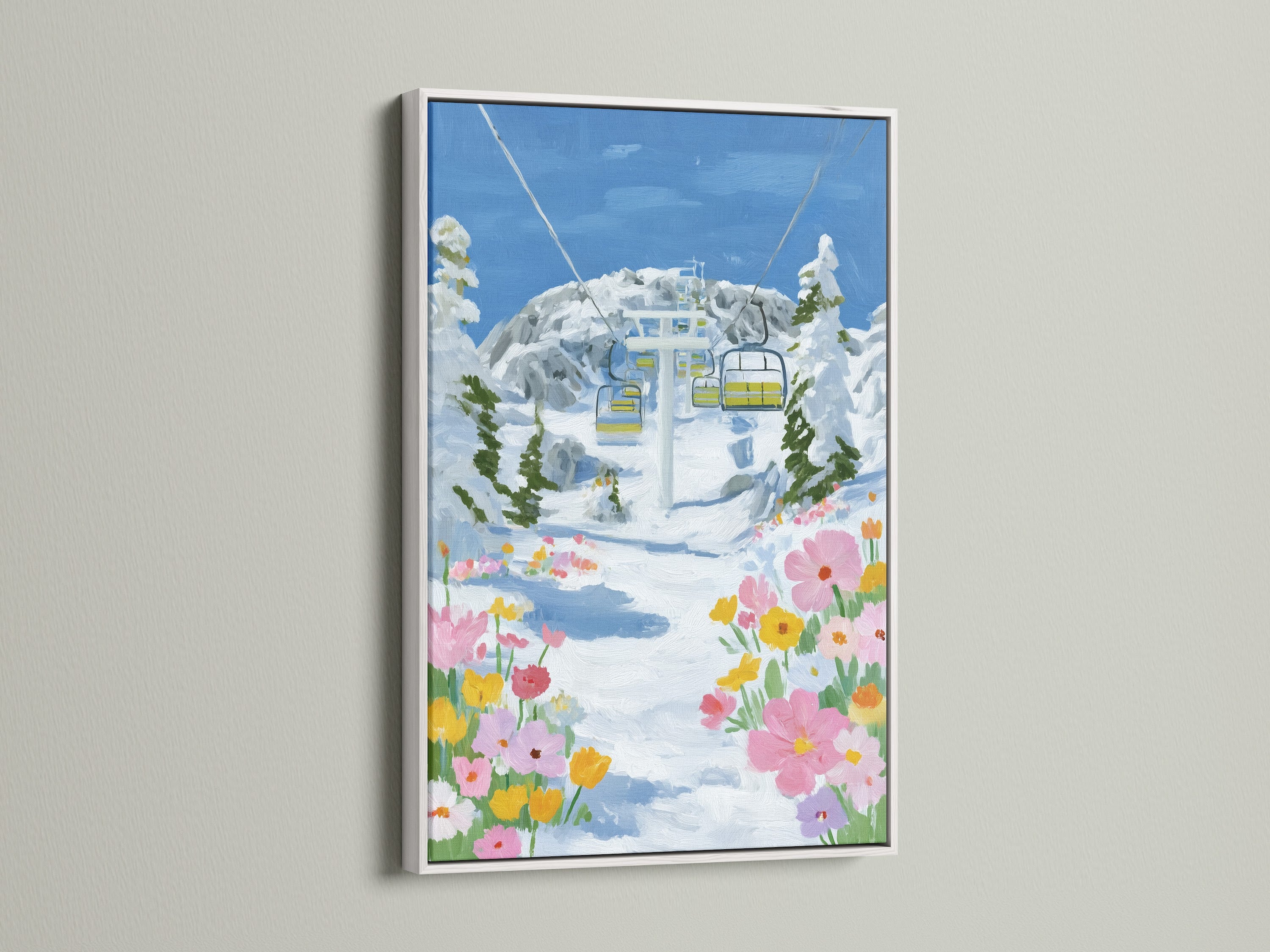 The Ski Lift Canvas Print is displayed in a white frame. The alpine print features a winter landscape. Wildflower artwork adds a touch of color. Ideal for eclectic and Scandinavian styled cabin wall artwork.