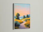 Sunset landscape artwork with a golden path print in a white frame. This peaceful wall decor is perfect for nurseries and country-themed interiors. The artwork brings a warm and inviting feel. It's an ideal choice for bedroom wall decor. Explore this nature canvas print today.