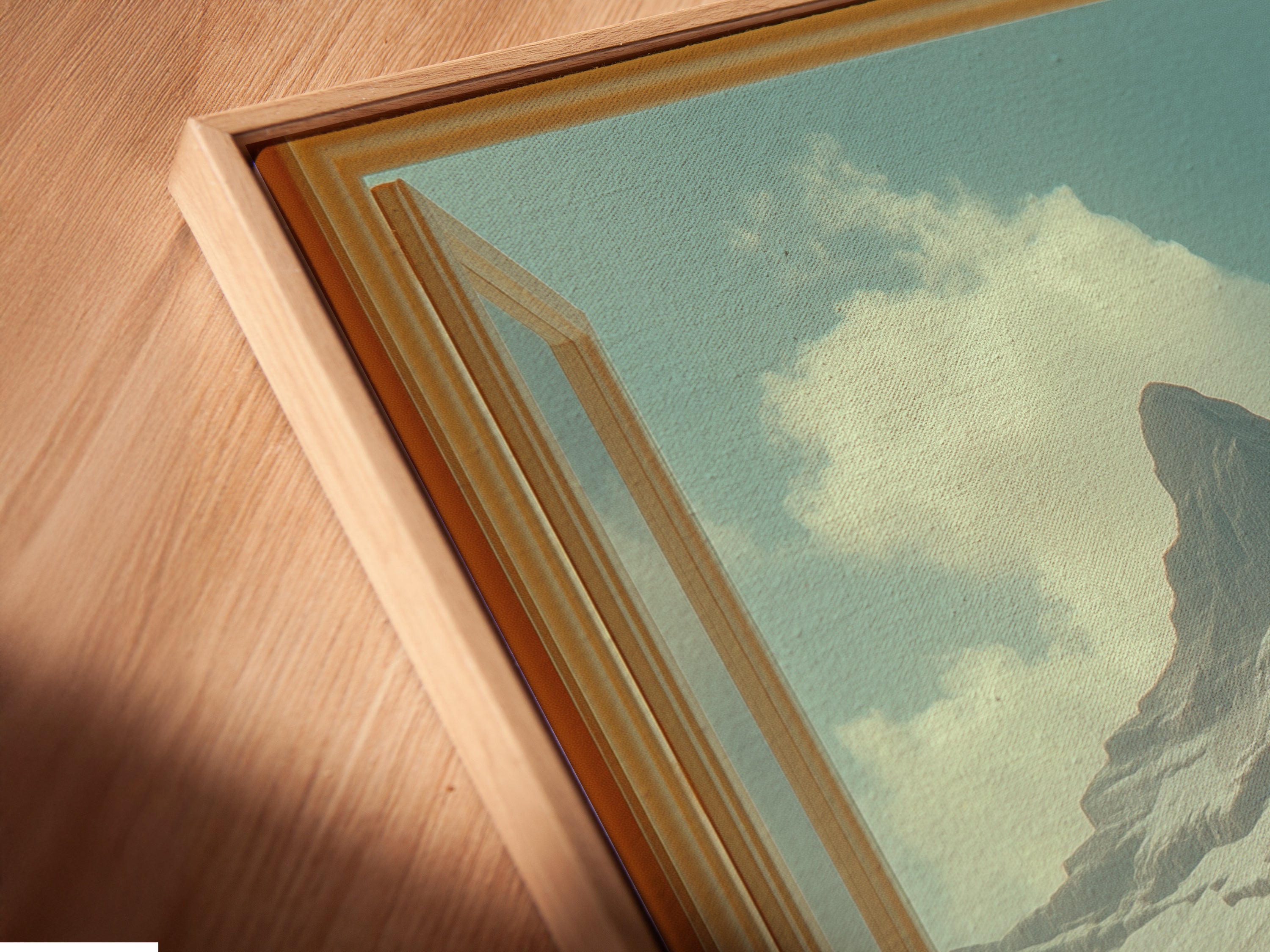 Angled close up of a canvas print in a floating frame. The mountain view artwork enhances modern spaces. The open window artwork brings the desert oasis to you. Perfect for vacation rentals. Elevate your living room with scenic artwork.