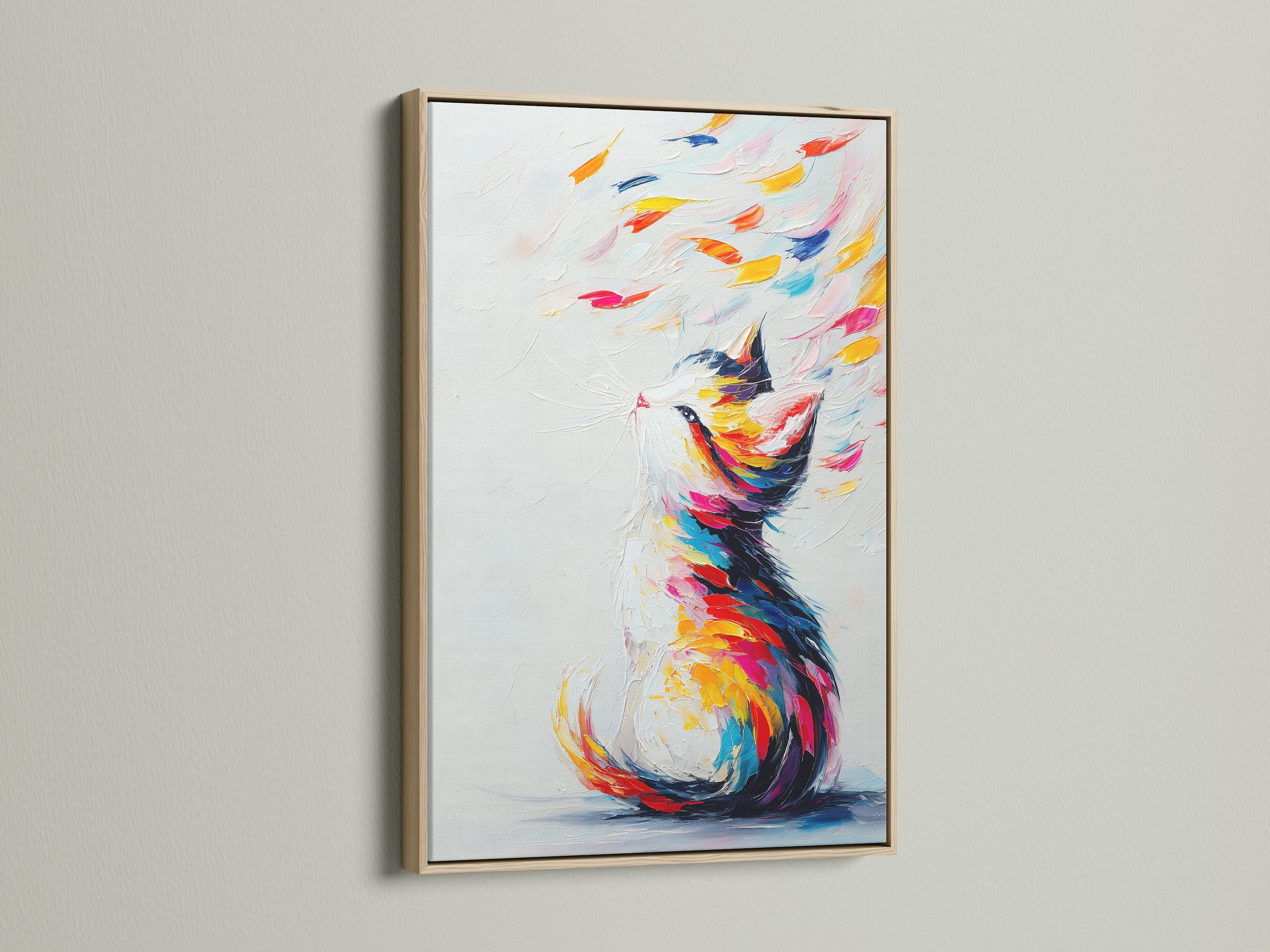 A close-up of a colorful cat artwork in an oak frame. The abstract pet print features vibrant rainbow colors. It will bring a touch of modern style to your living space. This feline artwork is ideal for pet enthusiasts. It enhances any room with its joyful contemporary style.